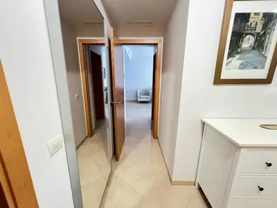 a bedroom with two beds and a window at WONDERFUL APARTMENT IN CANET DE BERENGUER. VALENCIA in Valencia