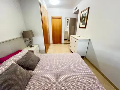 a white microwave with a tv on a wall at WONDERFUL APARTMENT IN CANET DE BERENGUER. VALENCIA in Valencia
