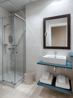 a bathroom with a sink and a shower at Opera House Valencia B&B in Valencia