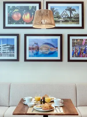 a table with food and drinks on top of a couch at Opera House Valencia B&B in Valencia