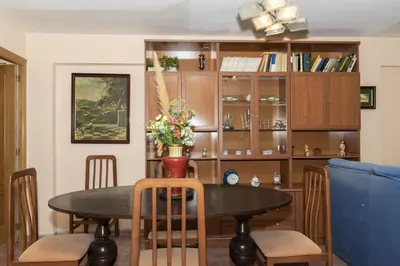 a dining room with a table and chairs at Mar y Montaña, 2º-18 in Cullera
