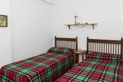 two beds sitting next to each other in a room at Estrella, 2º-10 in Cullera