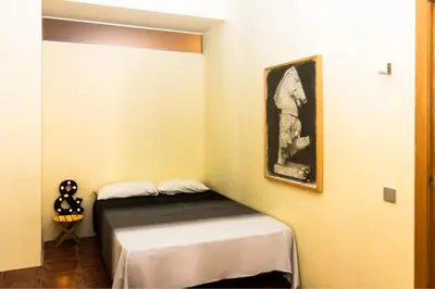 a bedroom with a bed and a picture on the wall at Fun&Happy VLC Center in Valencia