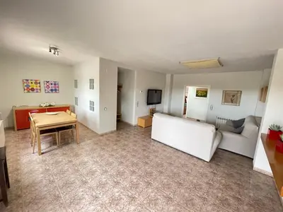 a living room with a couch and a table at Casa Maica in Lliria