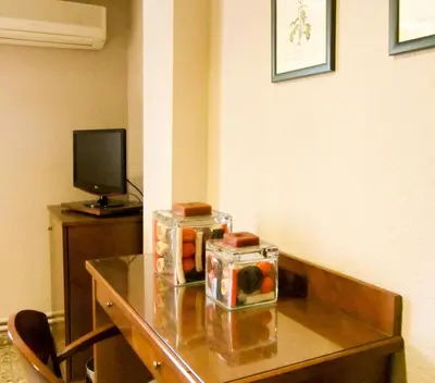 a table with a box of fruit on top of it at Hotel Avenida in Requena