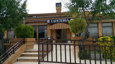 a building with a sign on the front of it at Hotel-Motel Sol II in Requena