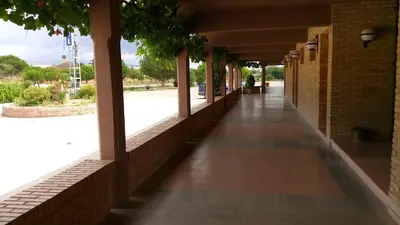 an empty hallway of a building with a sidewalk at Hotel-Motel Sol II in Requena