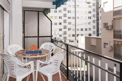 a balcony with a table and chairs on a balcony at Mari Carmen, 2º-8 in Cullera