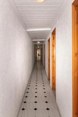 an empty hallway with a tiled floor in a building at La Ponderosa, 4º-21 in Cullera