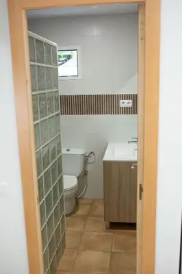 a bathroom with a toilet and a sink at Camping Barraquetes in Sueca