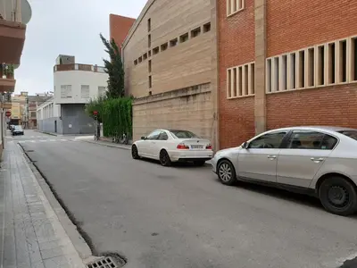 two cars parked on the side of a street at Burriana in Burriana