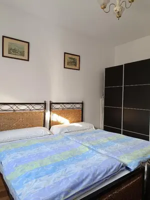 a bedroom with a large bed with a blue comforter at Burriana in Burriana