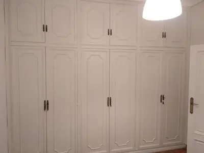 a cluster of white cabinets in a room at KM0 CENTRO CIUDAD in Valencia