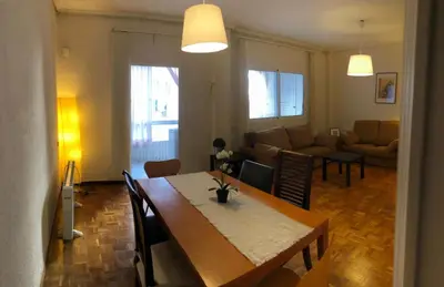 a living room with a dining table and a living room at KM0 CENTRO CIUDAD in Valencia