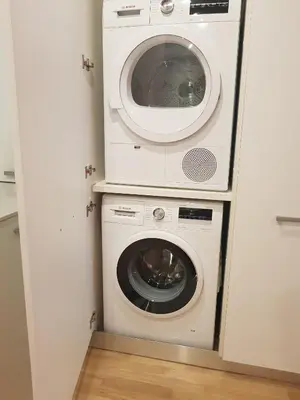 a washer and dryer in a small room at BONNIES Suites & Spa Valencia in Valencia