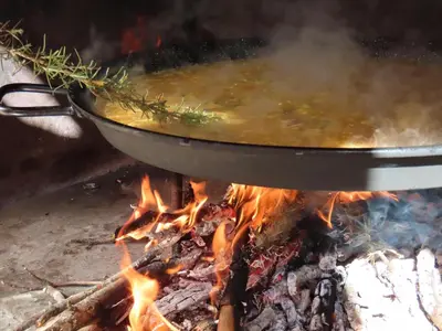 a pot of soup on top of a fire at Balcón de las Fuentes in Navarrés