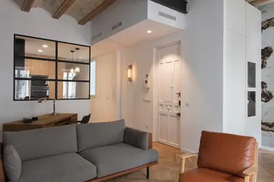 a living room with a couch and a table at FLORIT FLATS - Chic and Central in a lively but quiet area All walking distance in Valencia