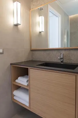 a bathroom with a sink and a mirror at FLORIT FLATS - Chic and Central in a lively but quiet area All walking distance in Valencia