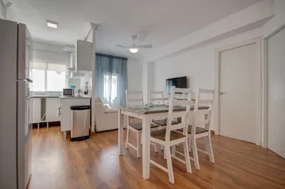 a kitchen and dining room with a table and chairs at Beds & Breaks Glinka in Valencia