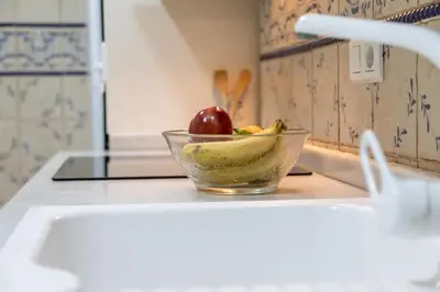 a bowl of fruit on a counter in a kitchen at My Loft 4 You Gran Via in Valencia