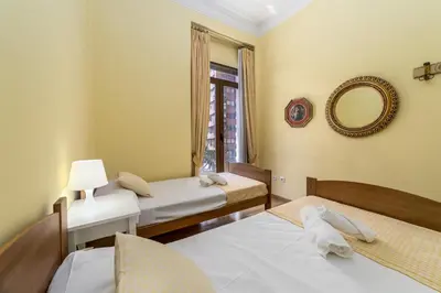a room with two beds and a mirror at My Loft 4 You Gran Via in Valencia