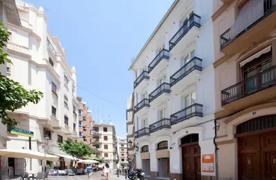 a group of buildings on a city street at Cosy Rooms Embajador in Valencia