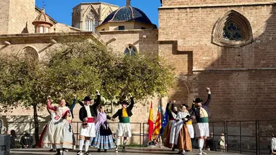 a group of people in costumes standing in front of a building at Cosy Rooms Embajador in Valencia