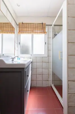a bathroom with a sink and a shower at Travel Habitat Cabanyal in Valencia
