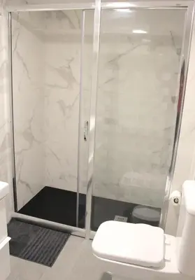 a shower stall with a toilet in a bathroom at Apartamento Luminoso cerca de la PLAYA y PUERTO in Valencia