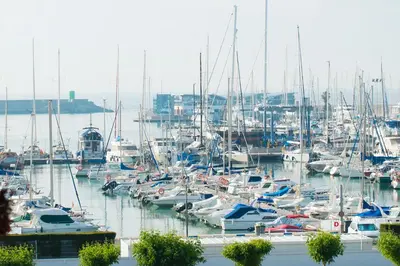 a bunch of boats docked in a harbor at Disfruta de unos días en la playa ¡Y mucho más! in Burriana