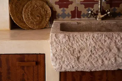 a bathroom sink with a granite counter top at Natural loft in Valencia