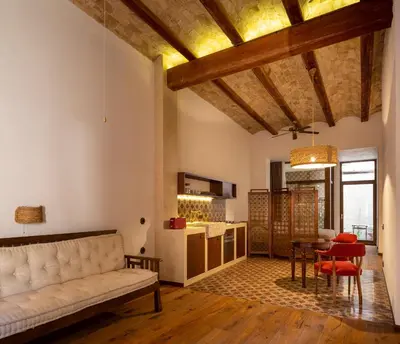 a living room with a couch and a table at Natural loft in Valencia