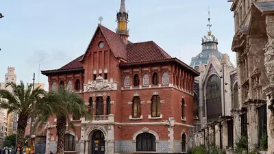 a group of people walking around a city at Cosy Rooms Tapinería in Valencia