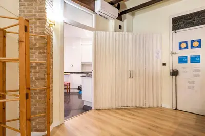 an open door in a room with a brick wall at Apartamento Ruzafa Centro II in Valencia