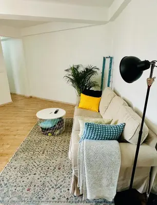 a living room with a couch and a table at Harbor Apartments Valencia in Valencia