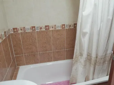 a bathroom with a tub and a shower curtain at Hetesa 2000, 3º-7 in Cullera