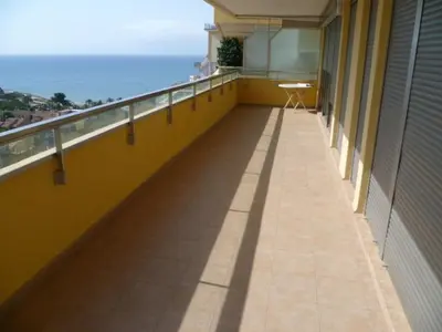 a balcony of a building with a view of the ocean at Hetesa 2000, 3º-7 in Cullera