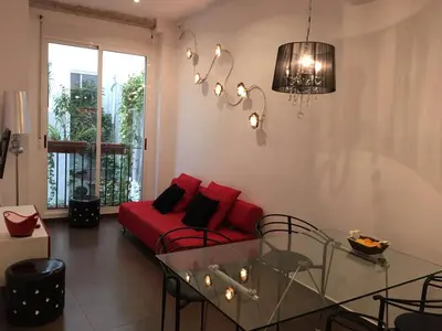 a living room with a couch and a table at Casa Cosy in Valencia