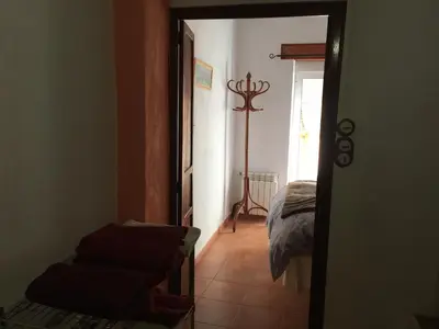 a hallway with a room with a bed and a floor at Ca'ls avis in Serra