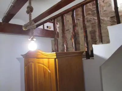a wooden cabinet with a light on top of it at Ca'ls avis in Serra