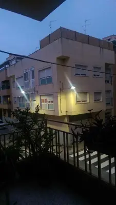 a building with lights on the side of it at Apartamento San Antonio in Sedaví