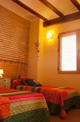 a bedroom with two beds and a window at Homely Nest Valencia El Carme in Valencia