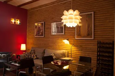 a living room with a couch and a chandelier at Homely Nest Valencia El Carme in Valencia