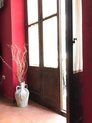 a vase sitting on the floor next to a door at Homely Nest Valencia El Carme in Valencia