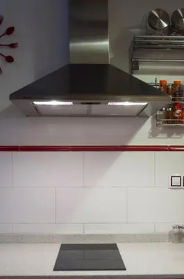 a kitchen with a hood over a stove top at Homely Nest Valencia El Carme in Valencia