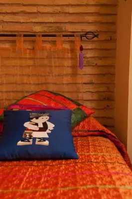 a bed with a pillow with a picture on it at Homely Nest Valencia El Carme in Valencia