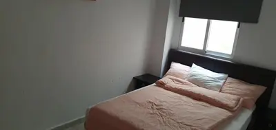 a small bedroom with a bed with a window at Apartamento Ciudad de las Ciencias 3 in Valencia