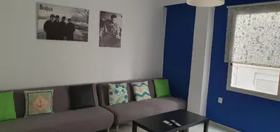 a living room with a couch and a table at Apartamento Ciudad de las Ciencias 3 in Valencia