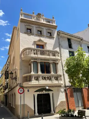 a building with a balcony on top of it at Varone in Requena