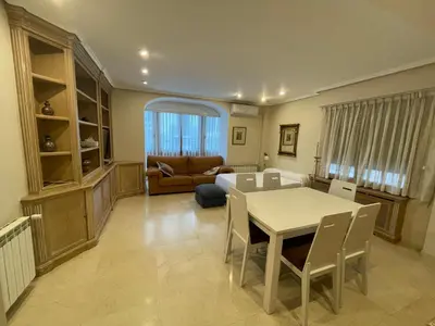 a living room with a table and a couch at Varone in Requena